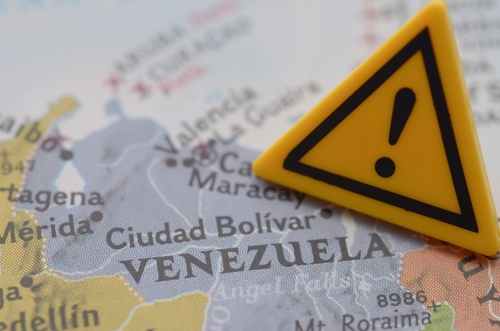 Venezuela,Crisis,Warning,Sign,On,Map,,Travel,Advisory,And